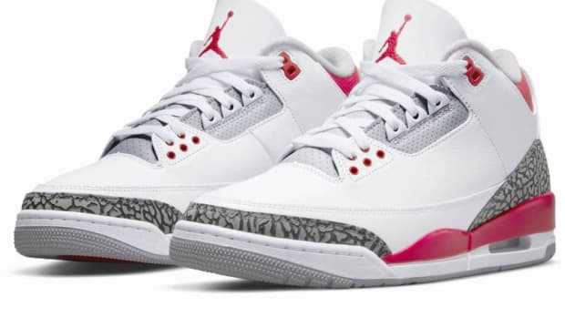 View of white and red Air Jordan sneakers.